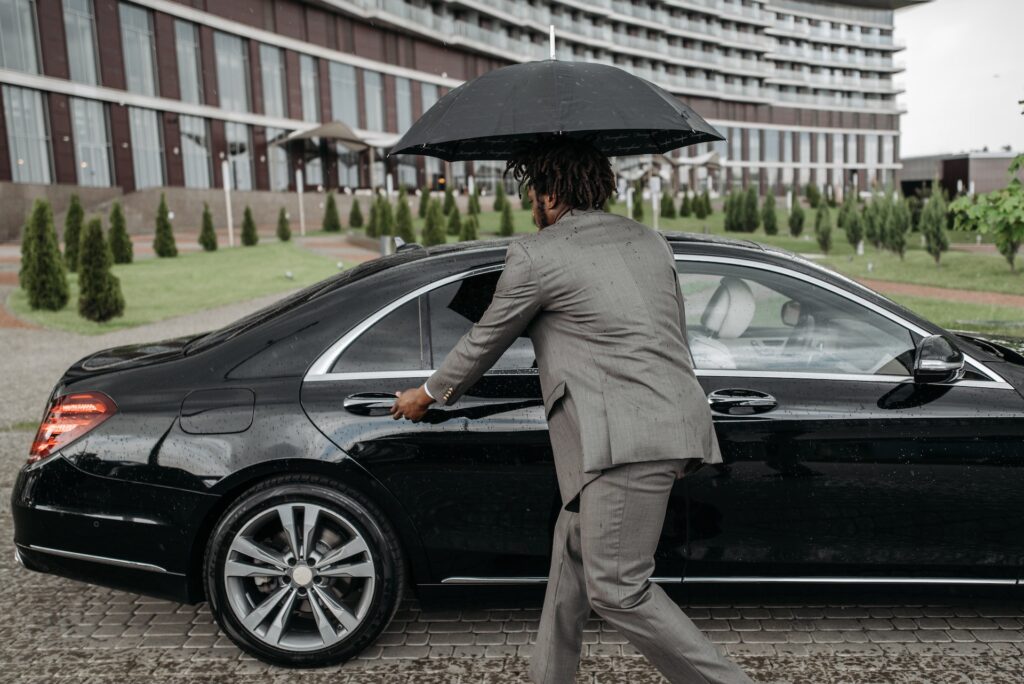 bodyguard hold an umbrella